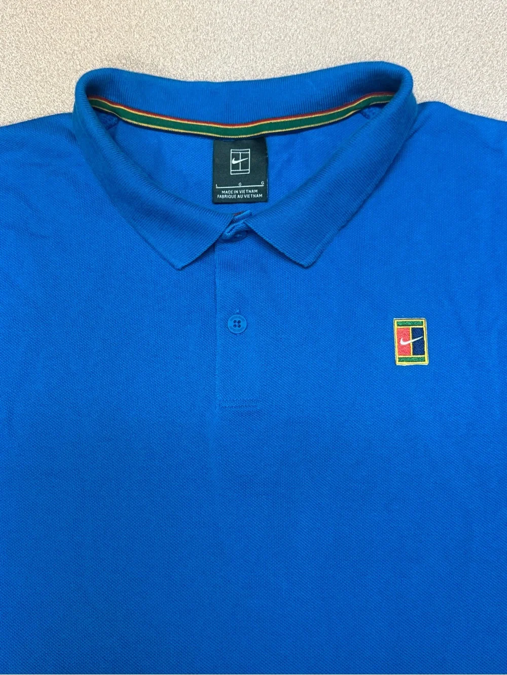 Nike Court Heritage Tennis Blue Polo Shirt with Small Multicolor Crest L